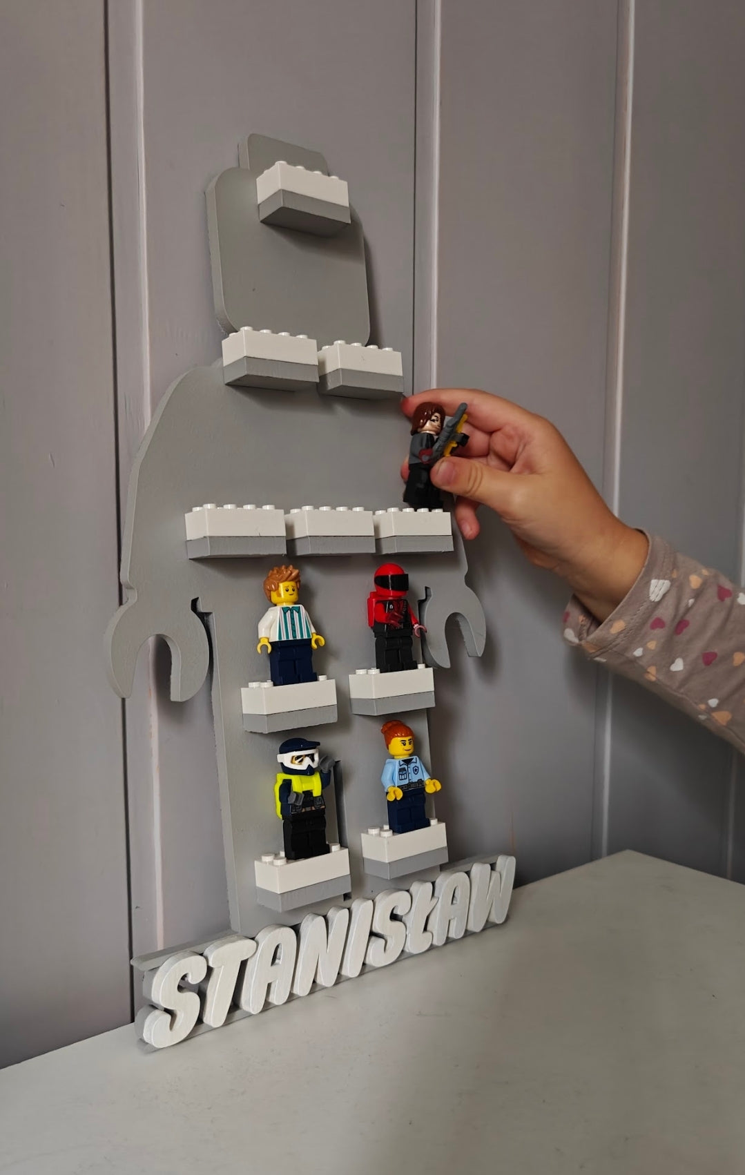 Figure-shaped shelf (compatible with LEGO®)